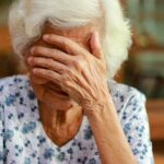 Upset elderly woman