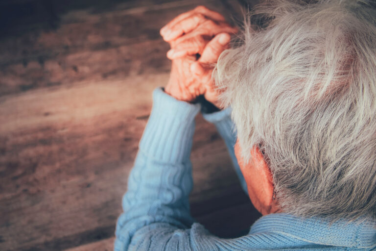 Senior citizen praying